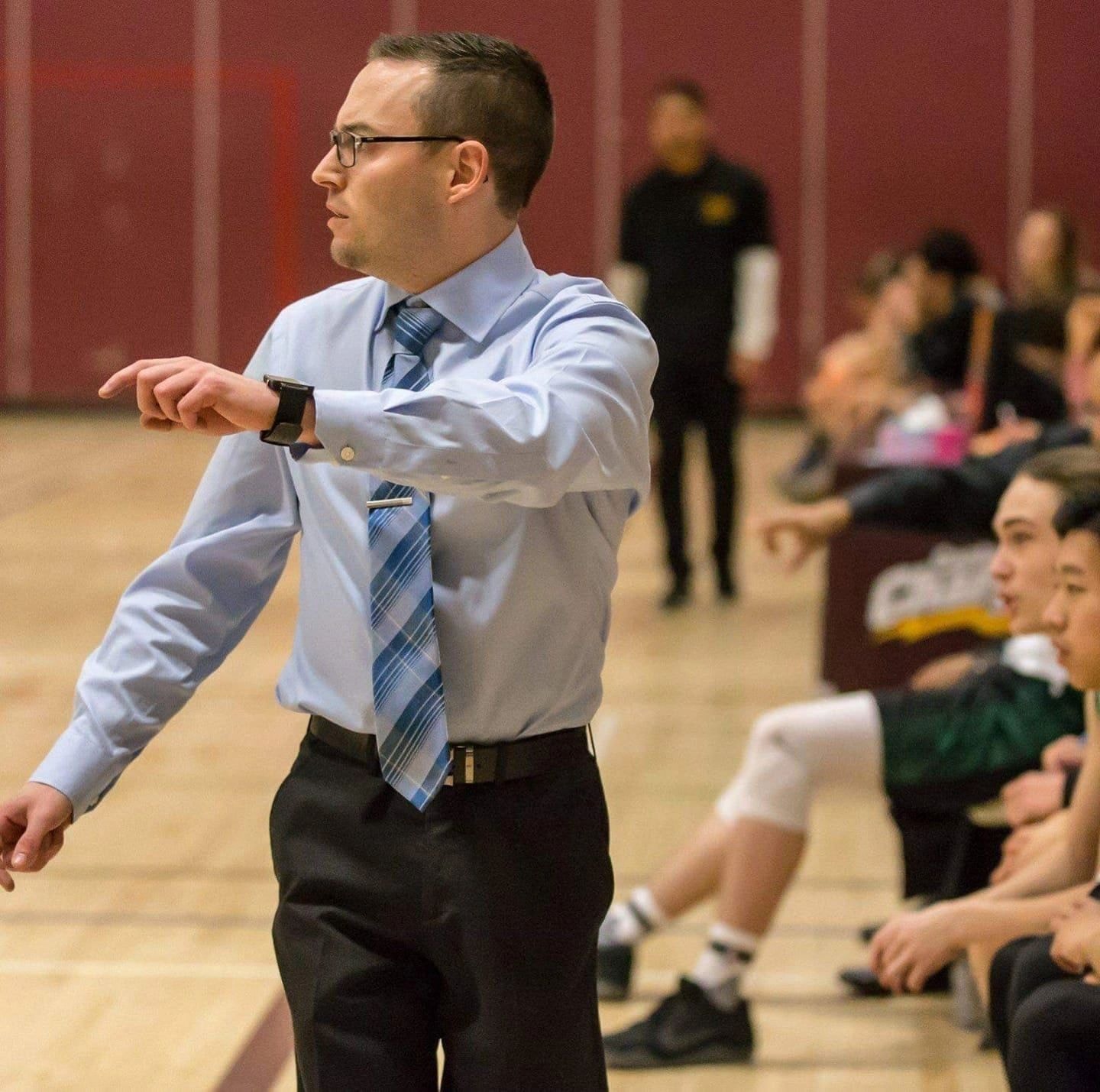 Etienne Couture presenting in a gymnasium